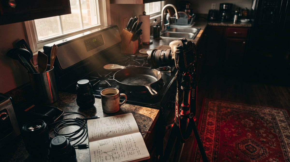 Camera and coffee mug set up on a kitchen counter for a Saturday filming day